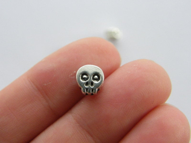 14 Skull spacer beads charms antique silver tone HC46