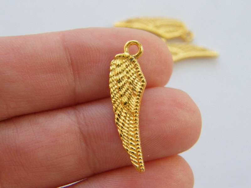 12 Angel wing charms bright gold tone AW122
