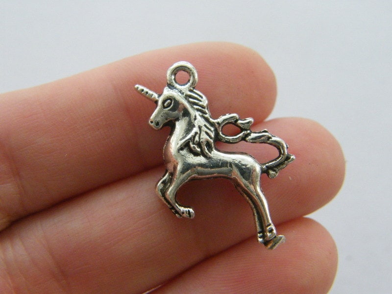 4 Unicorn charms antique silver tone A498