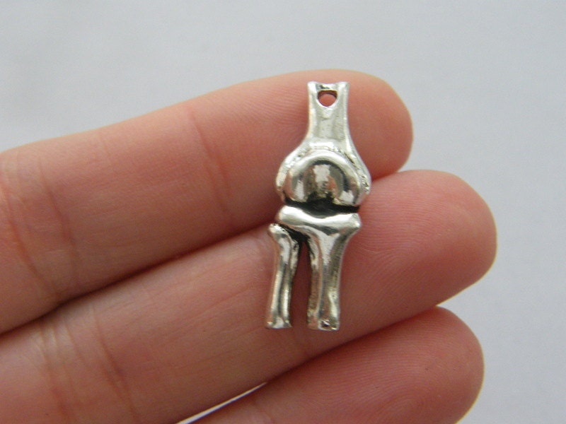 2 Knee bone charms antique silver tone MD93