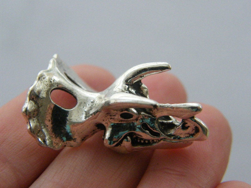 1 Dinosaur Triceratops skull charm antique silver tone A492