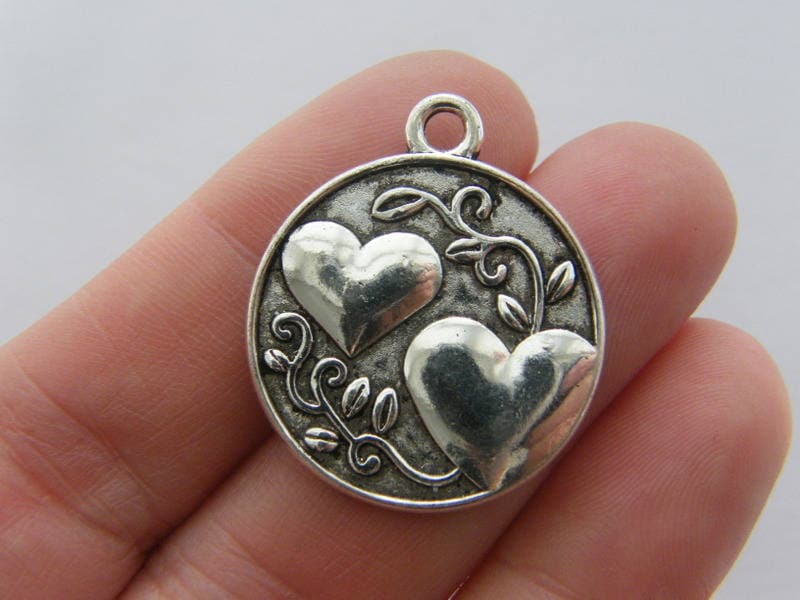 4 Sister heart  charms antique silver tone M269
