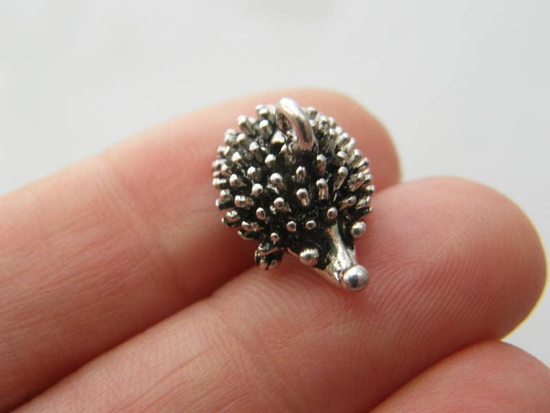 4 Hedgehog charms antique silver tone A656
