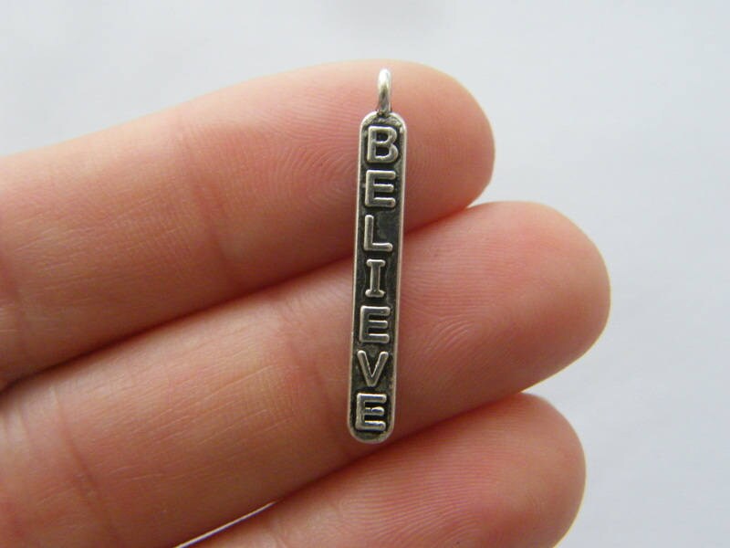 10 Believe charms antique silver tone M92