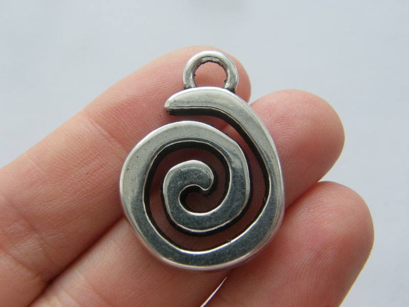 4 Spiral pattern charms antique silver tone M550
