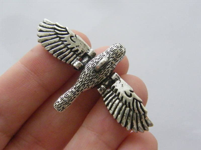 1 Bird movable wings charm antique silver tone B116