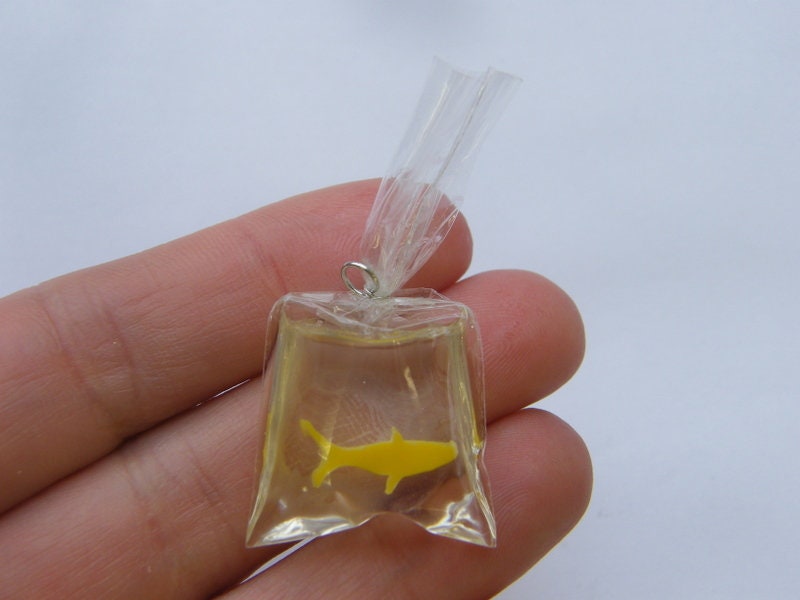 1 Resin yellow fish in a bag charm FF473