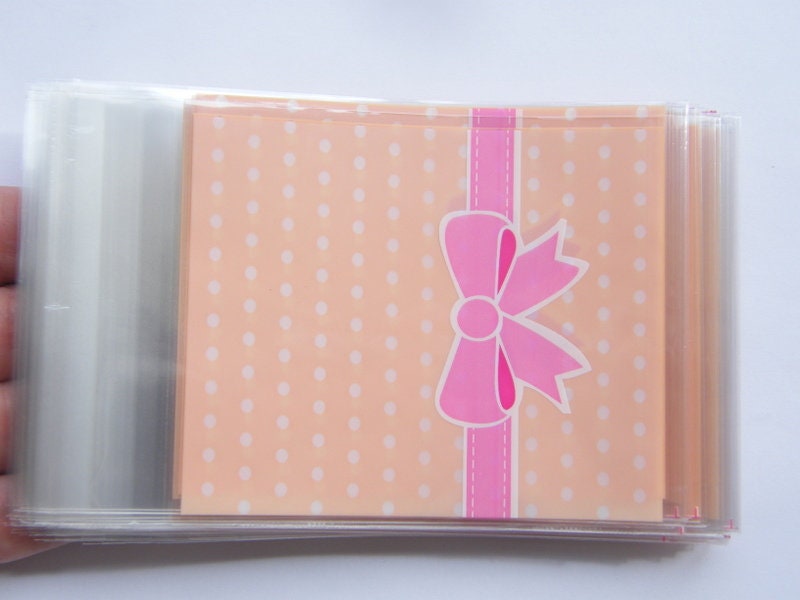 100 Pinky peach dots and pink bow cellophane packet bags - self sealing and resealable