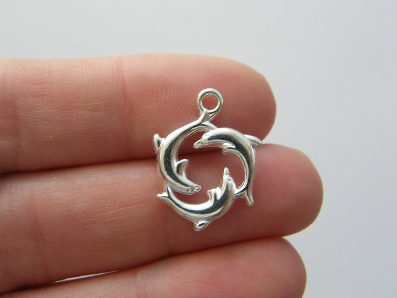 8 Dolphin charms silver plated tone FF461