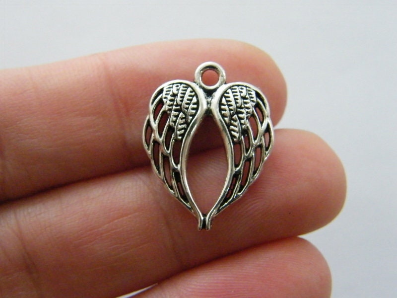 8 Angel wing charms antique silver tone AW40
