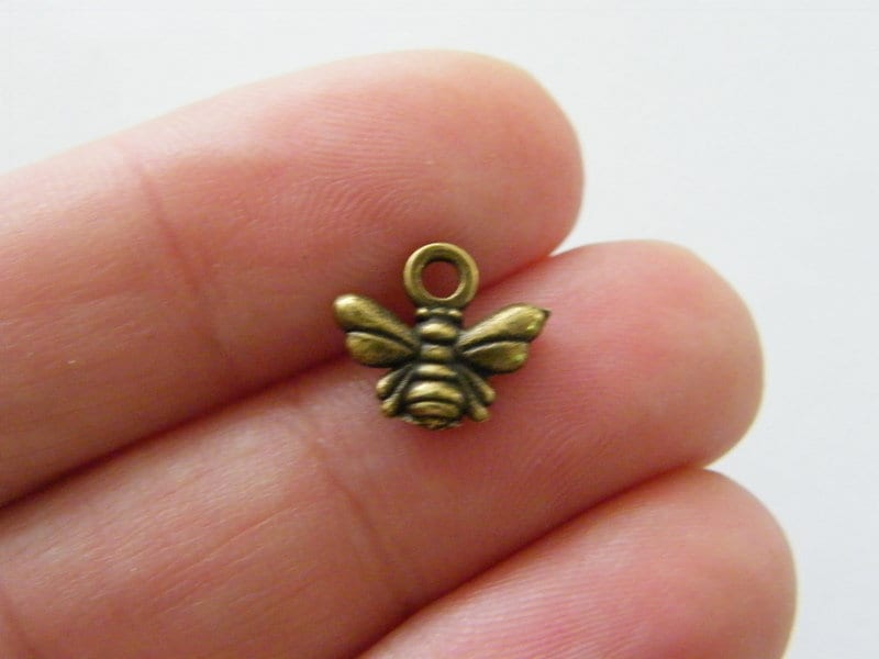 12 Bee charms antique bronze tone A855