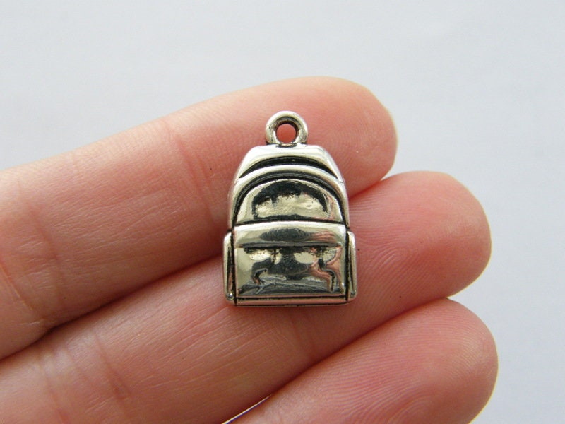 10 Backpack charms antique silver tone CA93
