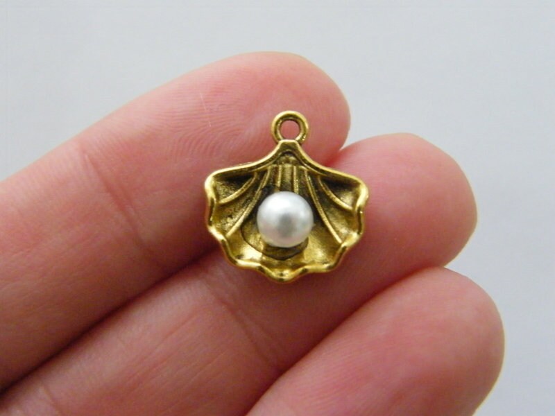 8 Pearl in oyster shell charms  antique gold tone FF673