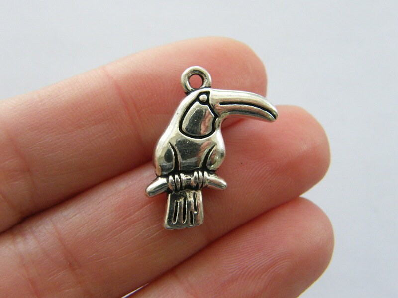 4 Toucan bird charms antique silver tone B158