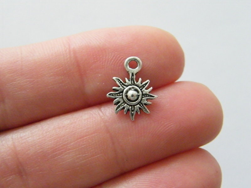 10 Sun charms antique silver tone S388