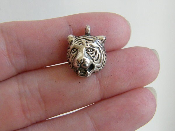 8 Tiger charms antique silver tone A149