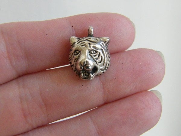 8 Tiger charms antique silver tone A149