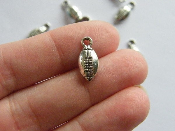 12 American football ball charms antique silver tone SP7