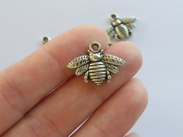 10 Bee charms antique silver tone A315