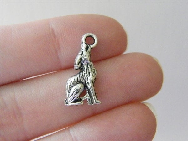 8 Wolf charms antique silver tone A285