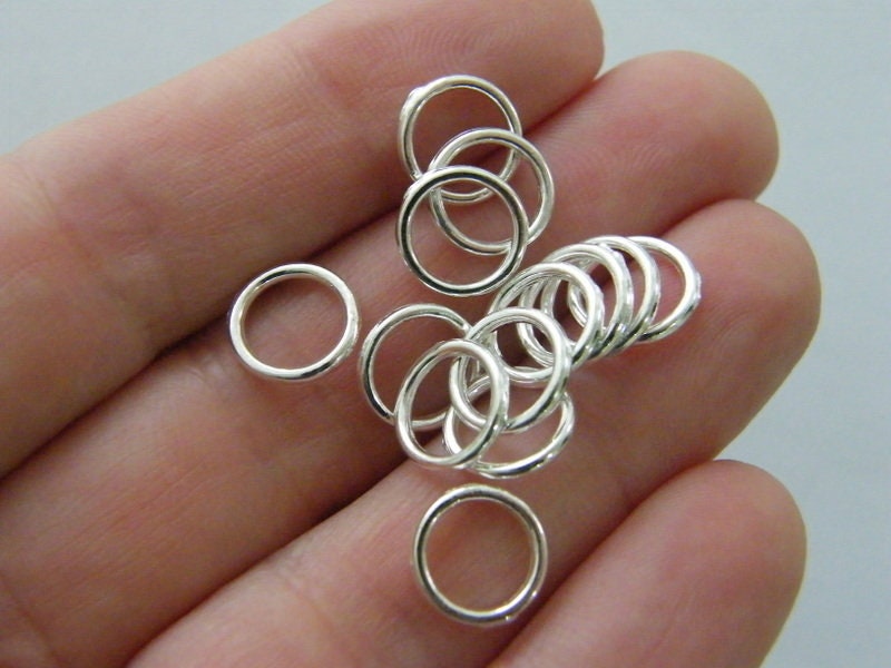 300 Spacer beads closed jump rings  10mm silver plated tone FS79