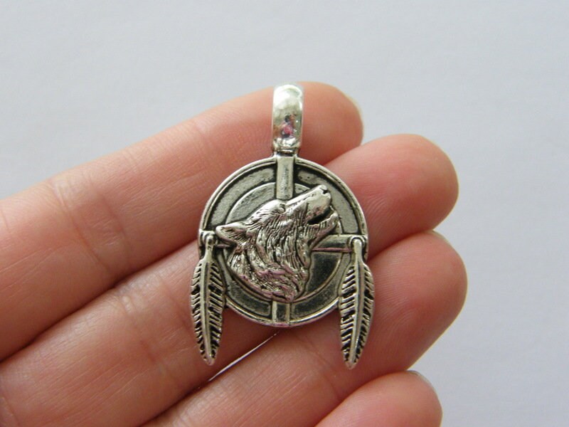 4 Wolf pendants antique silver tone A1101
