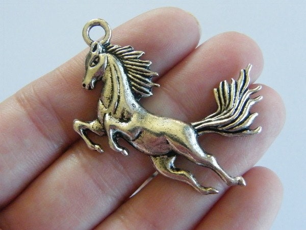 2 Horse pendants antique silver tone A598