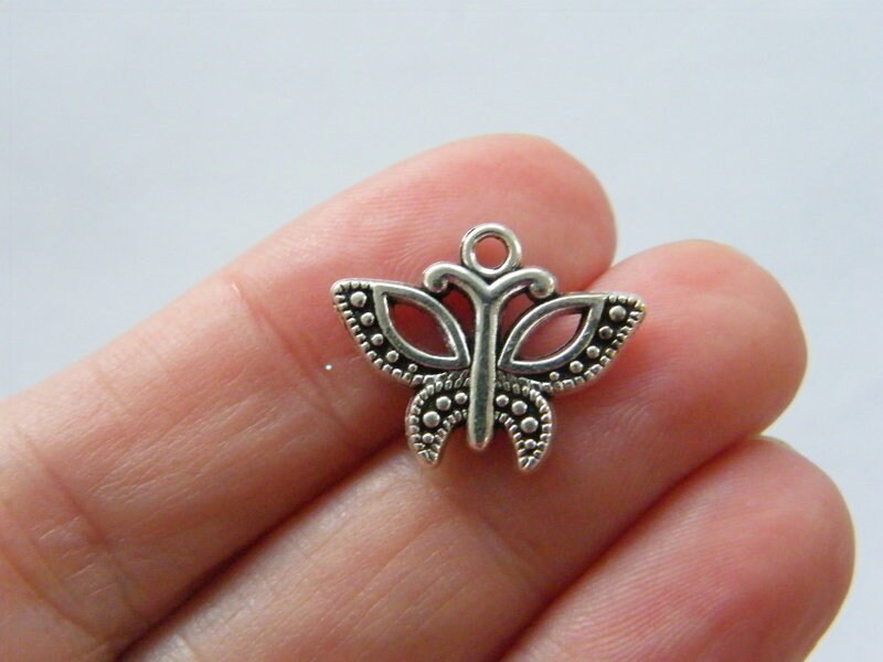 8 Butterfly charms antique silver tone A151