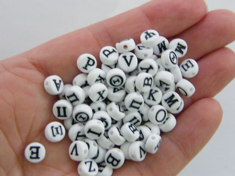 200 Acrylic white and black Greek letter RANDOM beads