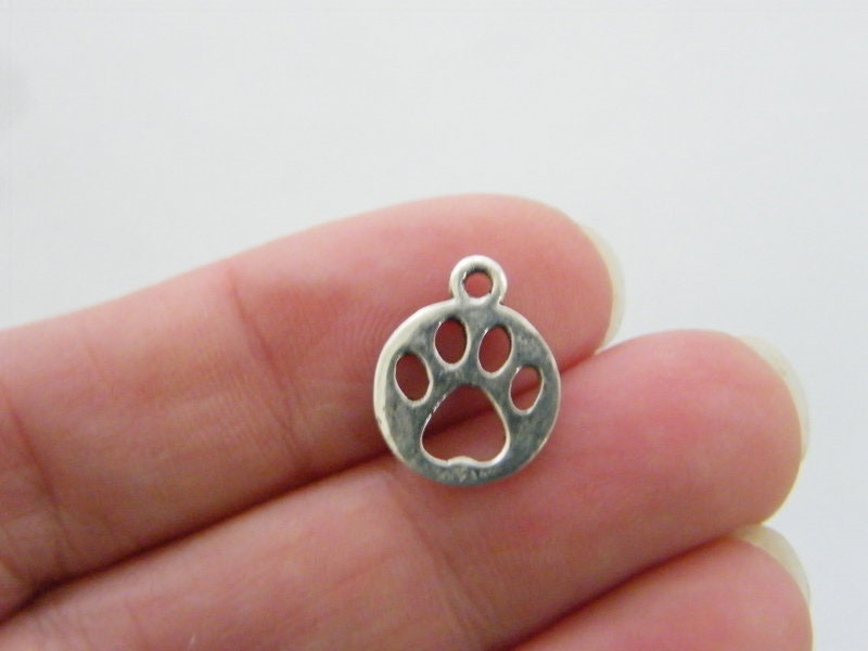 10 Paw charms silver tone A199