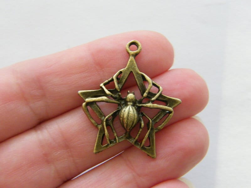 4 Spider star charms antique bronze tone HC374