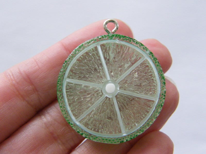 2 Lime slice pendants charms resin  FD313