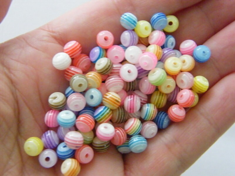 100 Random mixed stripe resin 6mm beads AB60
