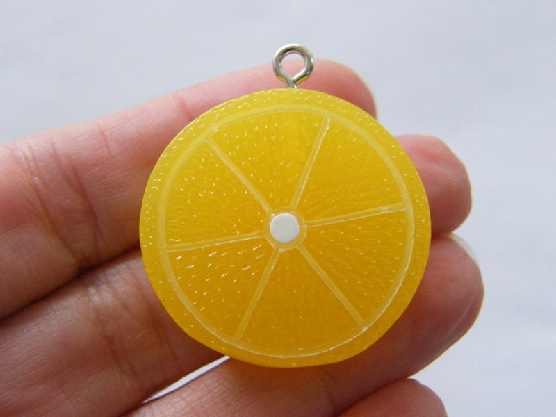 8 Lemon slice pendants charms yellow and white resin  FD312