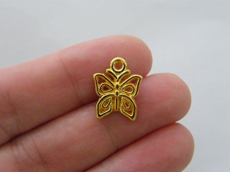 12 Butterfly charms  gold tone A234