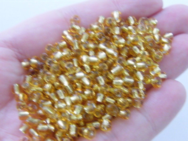 400 Gold with silver lining, glass, seed beads 4mm