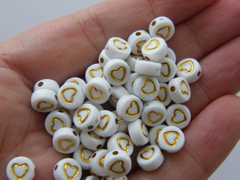 100 Heart white and gold acrylic bead AB107