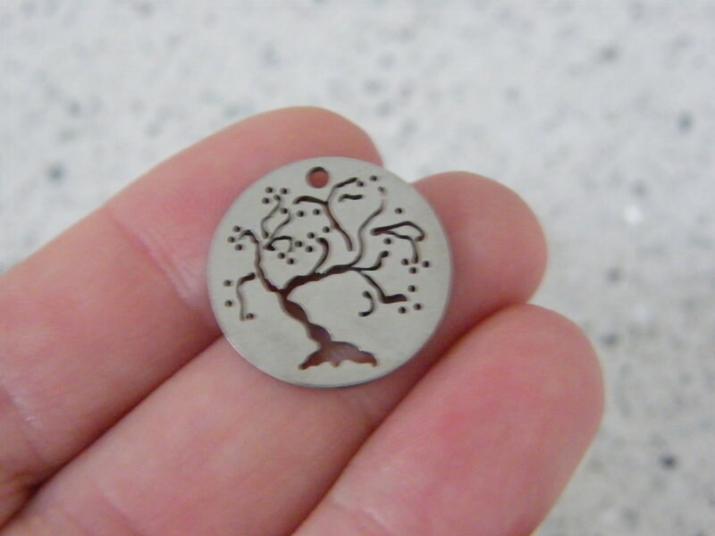 1 Tree cut out pendant silver tone stainless steel T82