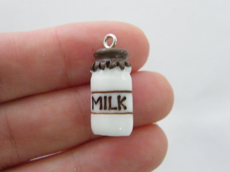 4 Milk charms white and brown resin FD433