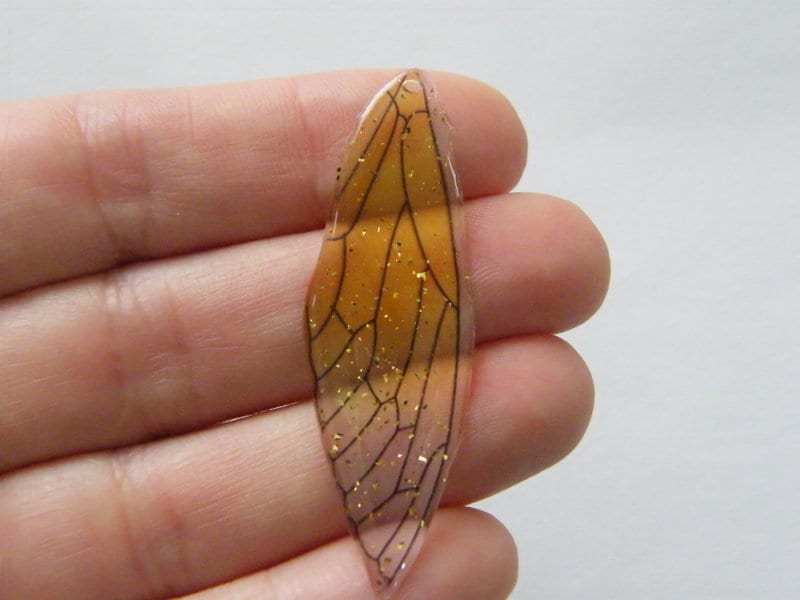 2 Dragonfly wing pendants yellow clear glitter resin A501