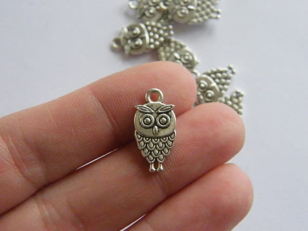 8 Owl charms antique silver tone  B297