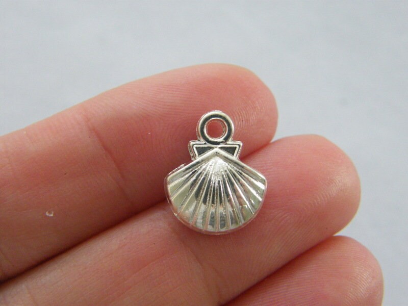 10 Shell charms  silver plated tone FF287