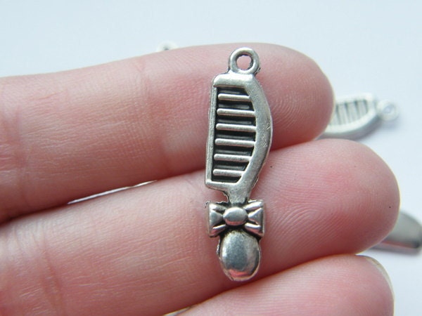 10 Comb charms tibetan silver P235