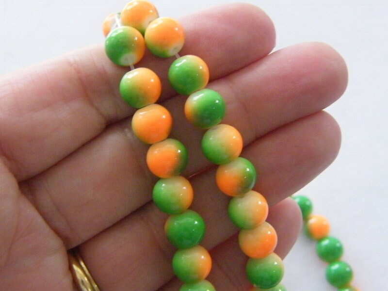 100 Two toned green and orange beads 8mm glass B134
