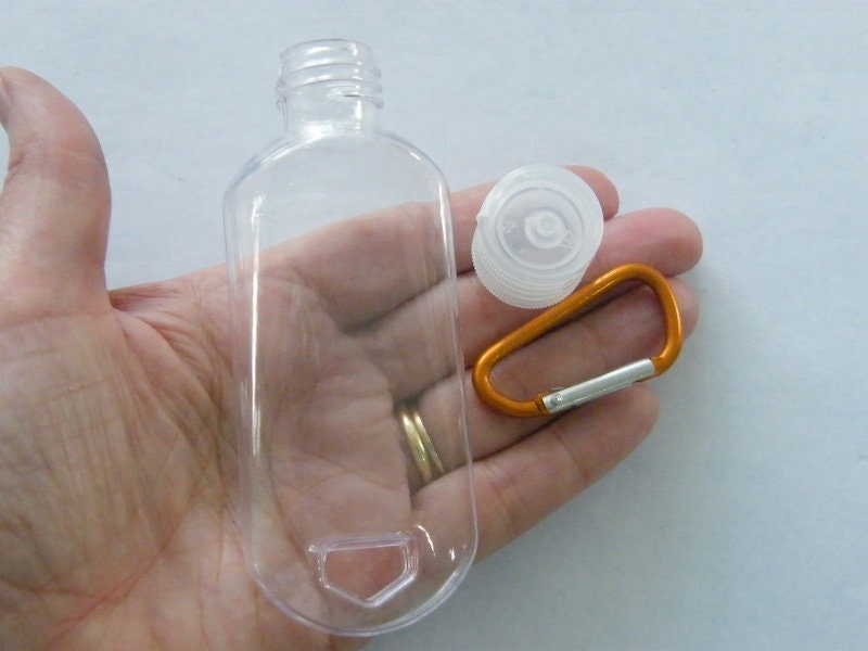 2 Clear bottles key ring refillable bottle lid key chain ( mixed random colour key chain )