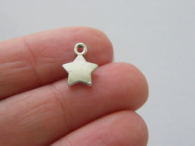 14 Star charms antique silver tone S227