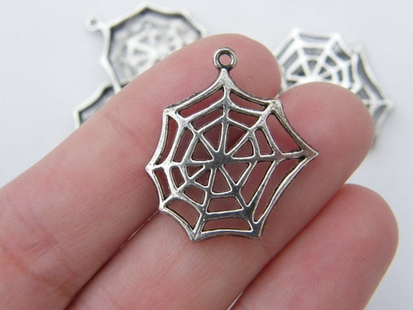 6 Cobweb or spiderweb charms tibetan silver HC132