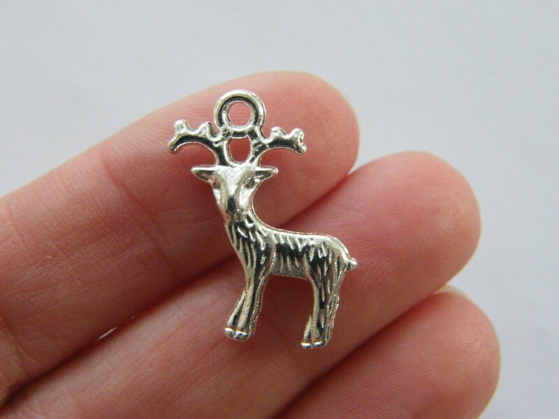 8  Reindeer charms silver plated tone CT152