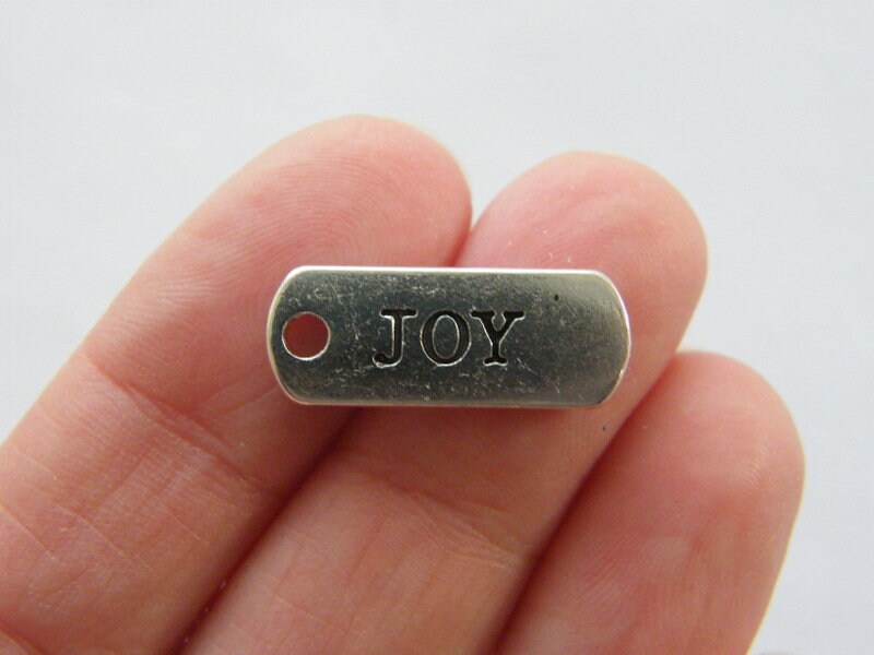10 Joy charms antique silver tone M380
