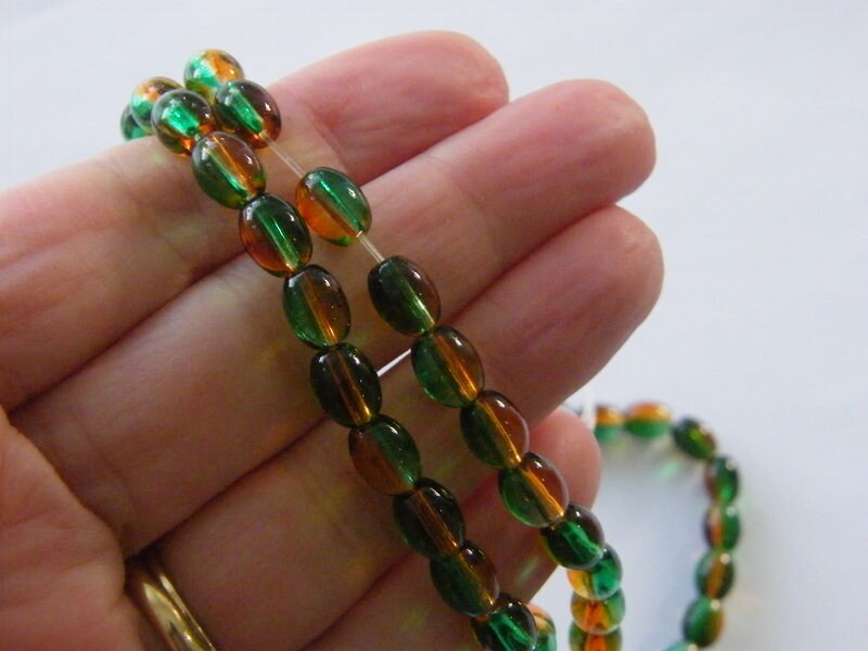 96 Orange and green oval beads glass B214
